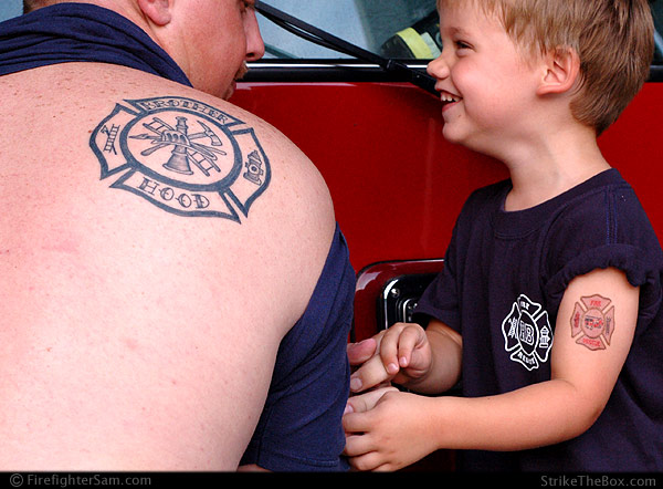 4 year old Sam compares tattoos with firefighter Ashley Abt